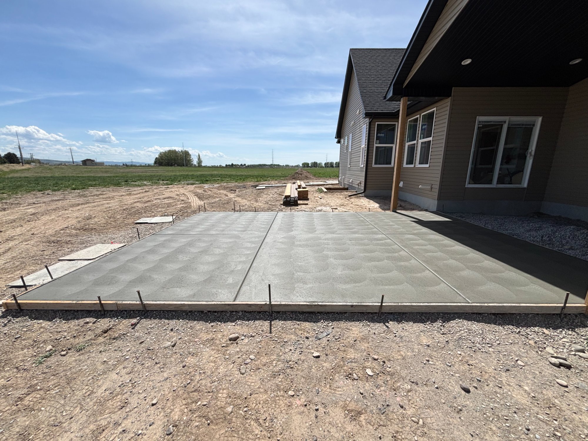 Broom finish concrete driveway installation Wyoming — Rock Range Concrete